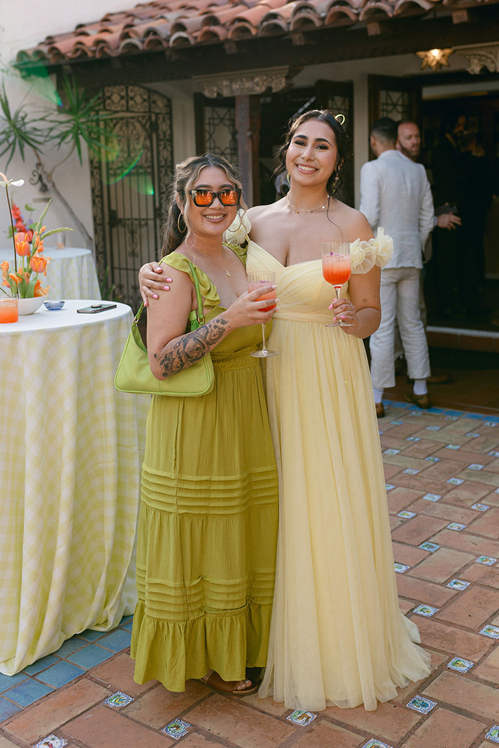 pastel yellow floral bridesmaid dresses Parasols, yellow bridesmaid dresses, AND colorful florals?! I just love summer weddings